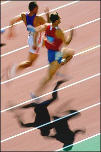 Decathletes compete in the 100m