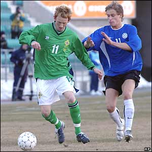 Northern Ireland's Steve Jones tussles with Tarmo Kink of Estonia