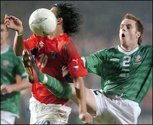 Milan Baros shrugs aside Alan Maybury to score the Czech's equaliser