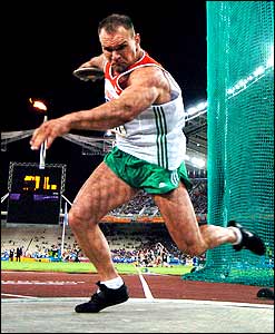 Hungary's Robert Fazekas competes in the Olympic men's discus throw final 