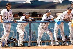 Japan's baseball players ruefully watch Australia's celebrations