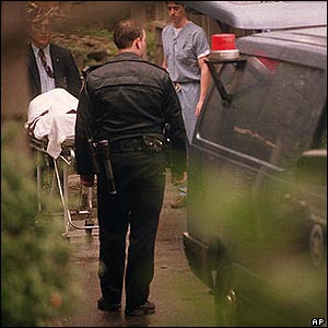 Kurt Cobain's body is taken away by medical examiners 