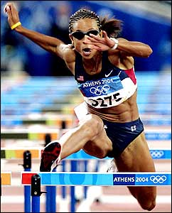 Joanna Hayes competes in the women's 100m hurdles event 