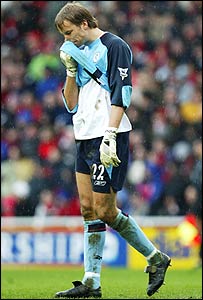 Jaaskelainen shows his disappointment after conceding an own goal