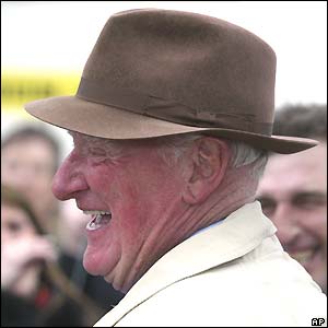 Amberleigh House's trainer Ginger McCain smiles after his horse wins the Grand National