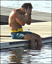 Alan van Coller sits on the jettty in despair