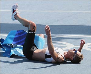 New Zealand's Hamish Carter crosses the line to claim gold