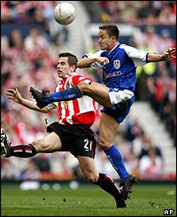 Sunderland's Paul Thirlwell challenges Millwall player-manager Dennis Wise