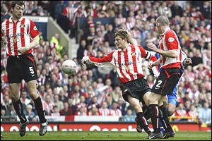 Sunderland defenders Gary Breen, George McCartney and Gary Breen are left helpless as Cahill scores
