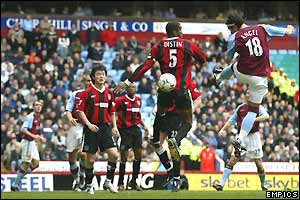  Villa striker Juan Pablo Angel heads in Thomas Hitzlsperger's corner 