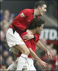 John O'Shea congratulates Ruud van Nistelrooy