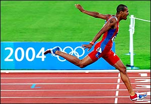 Dominican Republic's Felix Sanchez crosses the finish line of the men's 400m hurdles final 