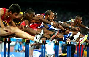 Athletes compete in the men's 110 metre hurdle semi-final 