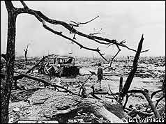 barren landscape with burned out bus