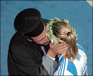 Ariel Moutsatsos picture of sailor Amila Tsoulfa being kissed by a priest