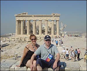 Des Brennan and Tina Collis pose in-front of the Acropolis