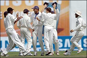 India celebrate the wicket of Yasir Hameed 