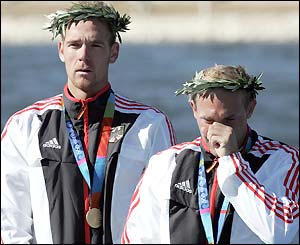 Tim Wieskoetter, right, shows his emotion on the podium alongside fellow K2 500m gold medallist Ronald Rauhe