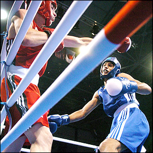 Khan gets round-one opponent Marios Kaperonis from Greece onto the ropes after a nervous start