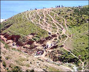 People crossing mountains near Ceuta