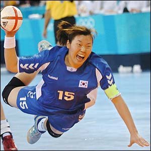 Im Jeong Choi goes on the attack in the women's handball final as Korea take on Denmark