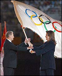 The Mayor of Athens passes on the Olympic flag 