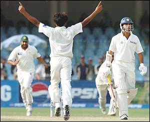 Sami celebrates the wicket of Yuvraj Singh