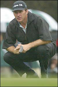 England's Nick Faldo lines up a putt