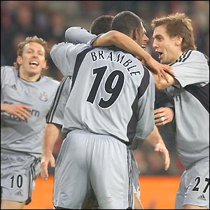 Newcastle players celebrate their equalising goal