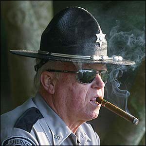 A Sheriff's deputy watches during the completion of the first round 