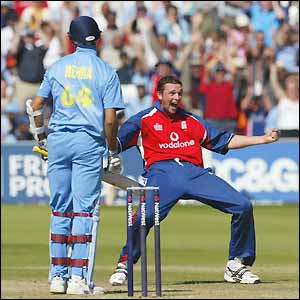 Steve Harmison takes the wicket of Ashish Nehra to claim a hat-trick and finish with figures of 3-41