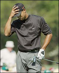 Tiger Woods misses a putt on the 11th hole
