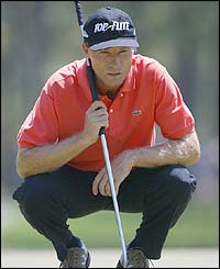 German veteran Bernhard Langer lines up a putt