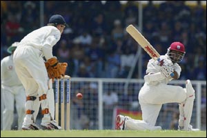 Brian Lara sends another England delivery away for four as Geraint Jones looks on