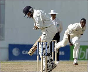 Fidel Edwards bowls a bouncer at England's Mark Butcher
