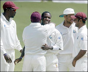 The West Indies' players celebrate their success in the field