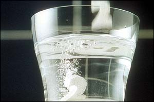 Fizzing tablet in glass