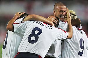 Lampard is mobbed by his England team-mates
