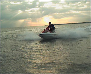 Matthew Davies on his jet-ski, with Porthcawl in the distance