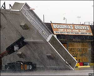 A gas station pump and awning which toppled over in Fort Pierce