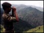 Indian soldier with mountains in background