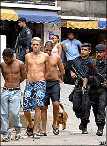 Suspects being escorted by police