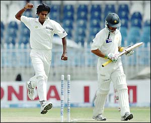 Lakshmipathy Balaji celebrates taking the wicket of Kamran Akmal