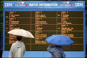 Fans check out the electronic schedule in New York