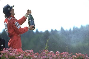 Ayrton Senna celebrates one of his five victories in the Belgian Grand Prix