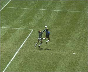 Maradona handles the ball past England's Peter Shilton during the 1986 World Cup in Mexico 