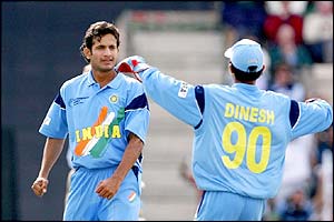 India's bowler Irfan Pathan is congratulated by wicket keeper Dinesh Karthik 