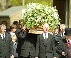 Pallbearers carrying coffin