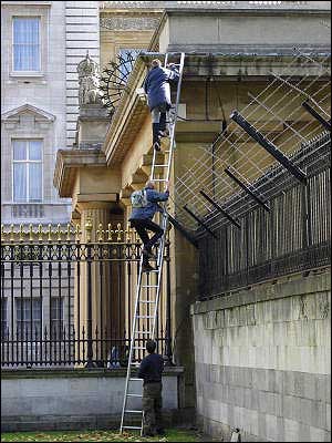 Batman and Robin ascend the ladder