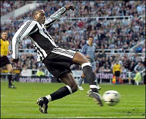 Shola Ameobi stetches to get a shot off but it's saved by Fabien Barthez